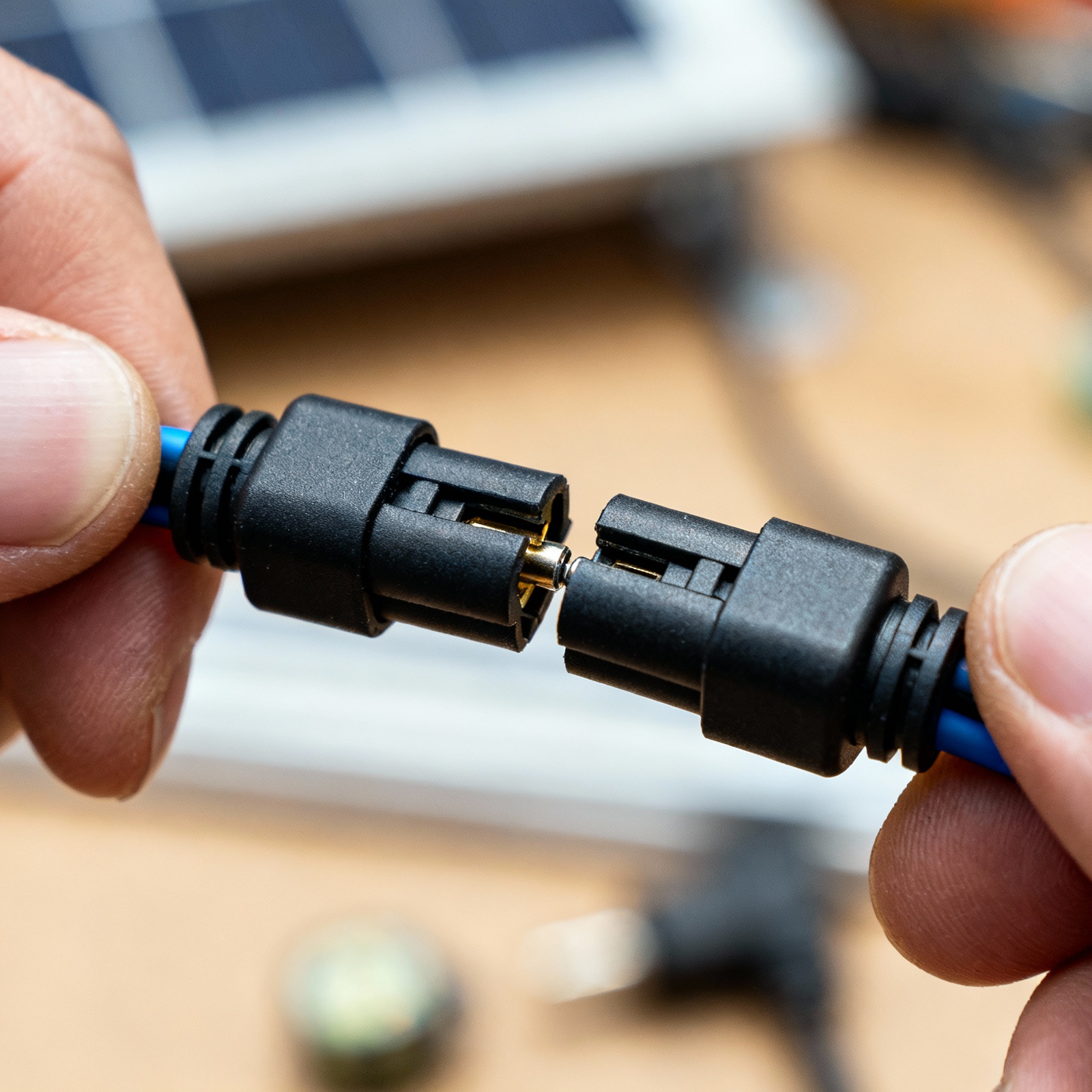 Close-up of MC4 solar connectors being connected for RV solar installation