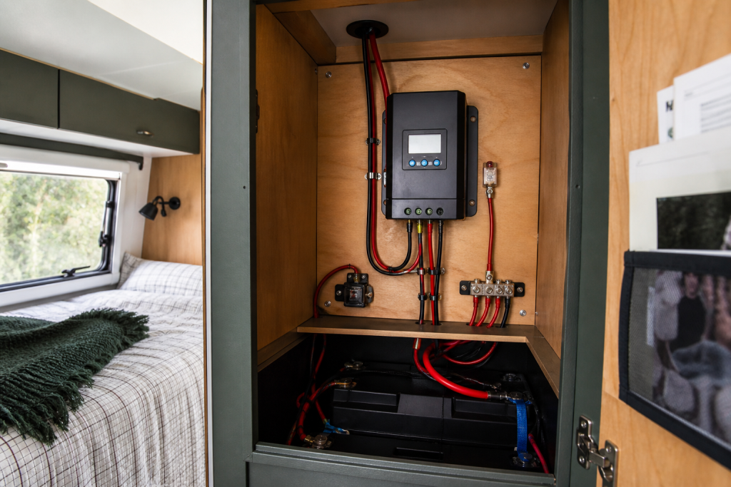 MPPT charge controller wired neatly in RV cabinet for solar charging